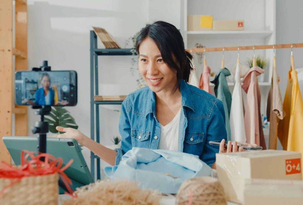 Asian woman explaining how to launch a live shopping event in 7 steps